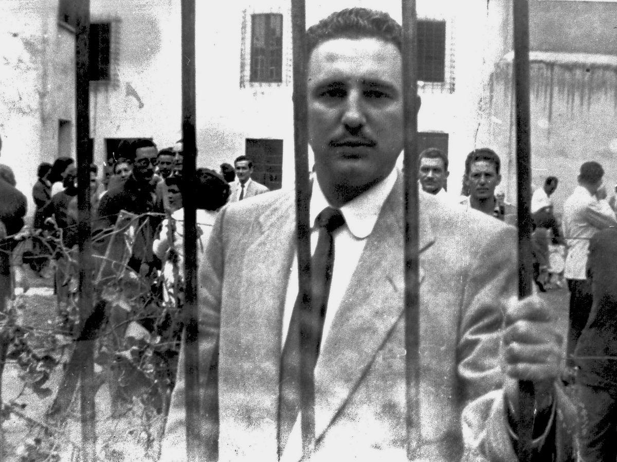 Castro behind bars.