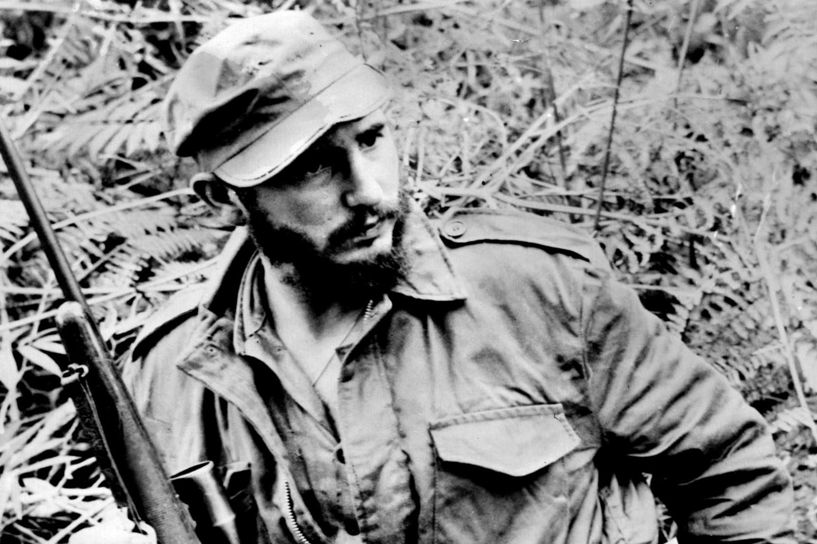 Castro posing with a Rifle.